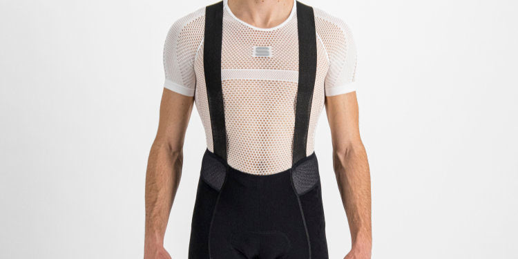 Shoulder to hips studio shot of man in Sportful Total Comfort Bib Shorts