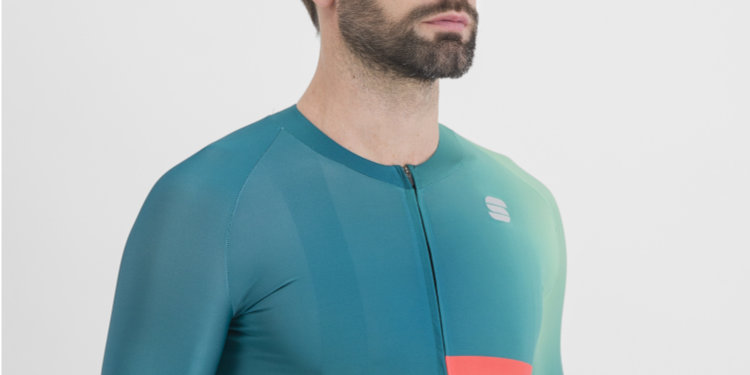 Studio chin and shoulders shot of man wearing a spruce coloured Sportful Bomber Jersey