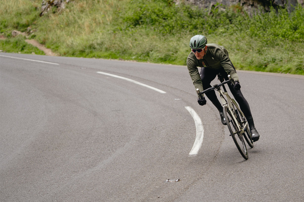 Male cyclist riding bike in Sportful bibtights