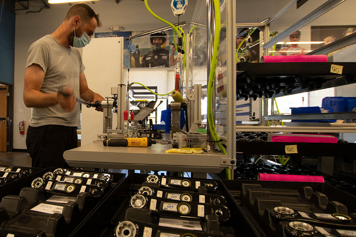 Stages technician fitting a power meter to a crank