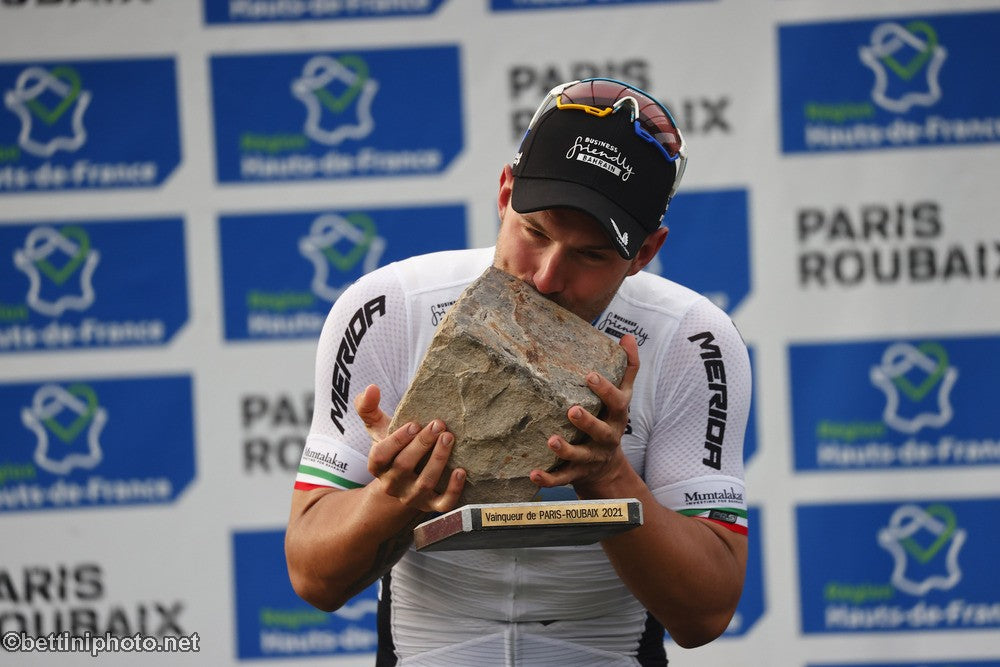 Winner Sony Colbrelli kisses the Paris-Roubaix cobblestone trophy