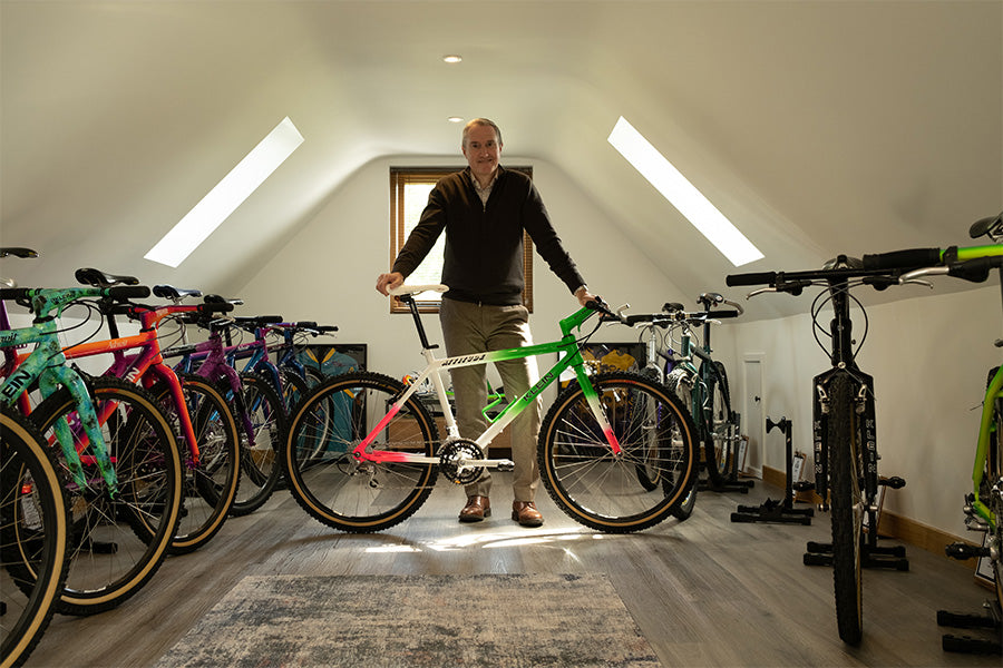 Saddleback CEO Andy Wigmore leans on his 1991 Klein Attitude bike in his attic