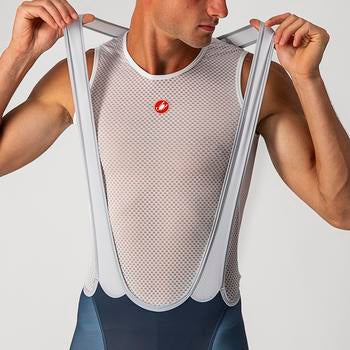 Model stretching out the straps of Castelli official Team Italy Olympic bib shorts,