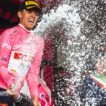 Head and shoulders closeup of Giro pink jersey holder Juan Pedro Lopez@GettyImages