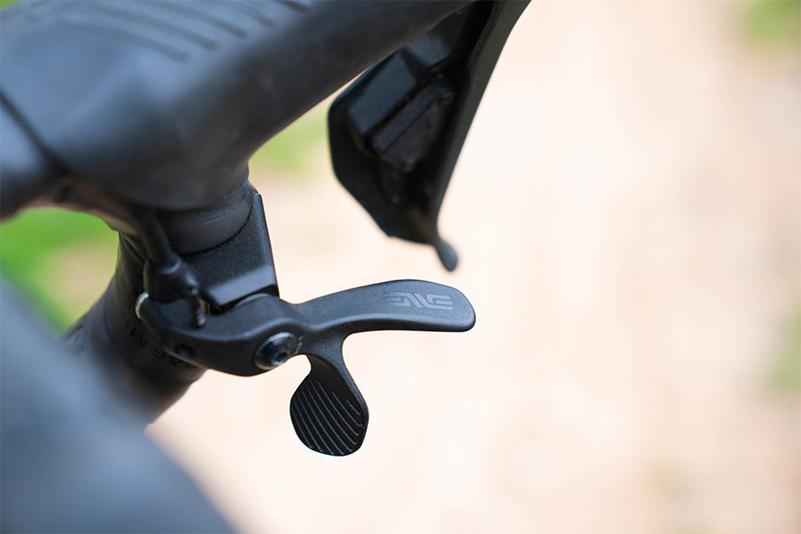 Outdoor closeup of a textured black ENVE dropper lever