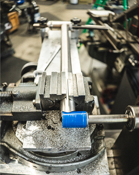 A titanium frame in a vice ready to be worked on