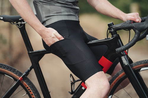 Rider wearing Castelli Unlimited Bib shorts  showing the pocket opening