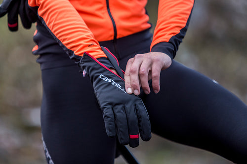Close up of the Spettacolo RoS Gloves on someone's hands as they zip the gloves up