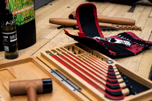 Assorted Silca tools and products lying on a wooden work bench