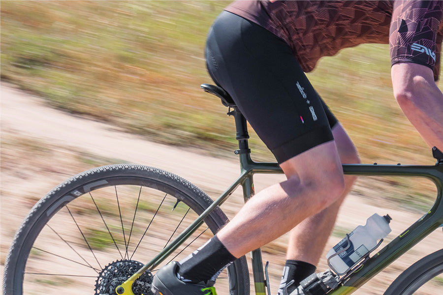 Man cycling on gravel with ENVE dropper post