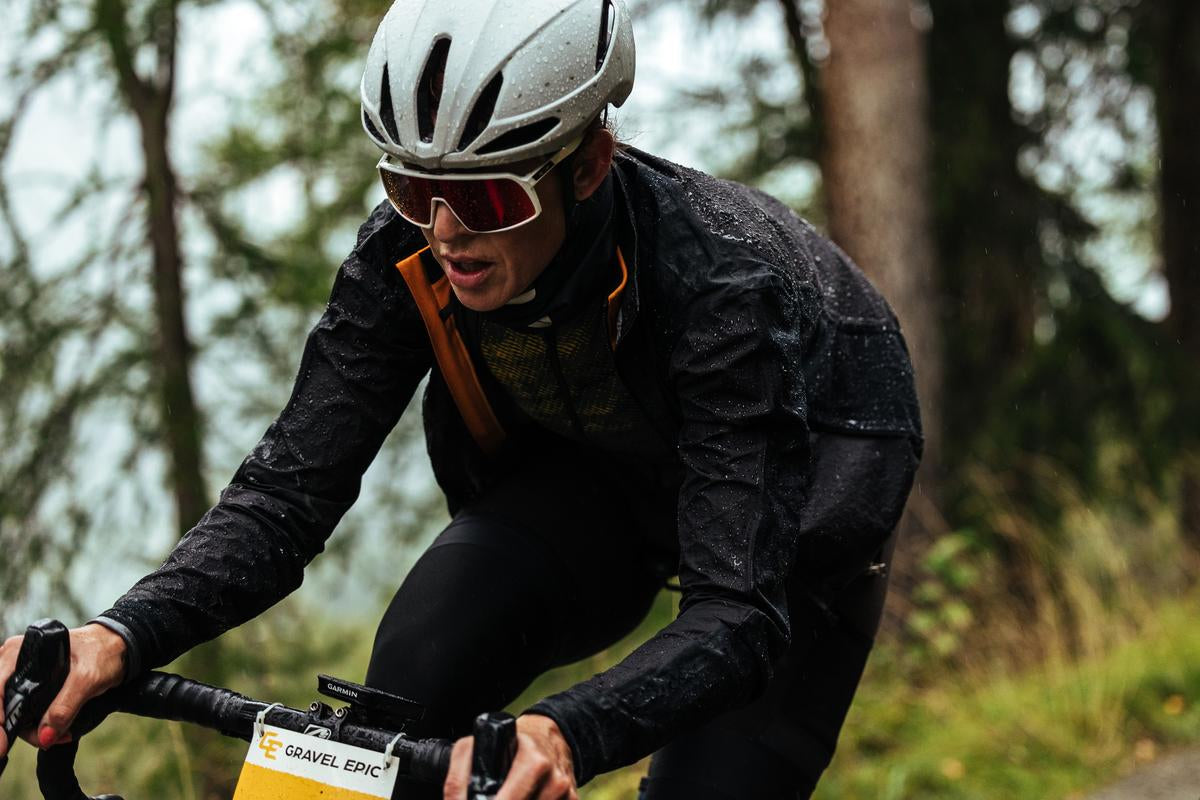 Female cyclist riding in the rain in Sportful Supergiara kit