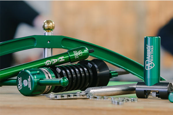 An assortment of well lit green black and silver Abbey Bike Tools