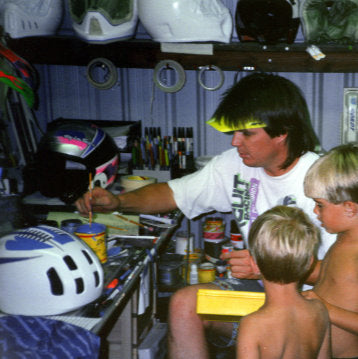 A young Troy Lee at work hand painting helmets