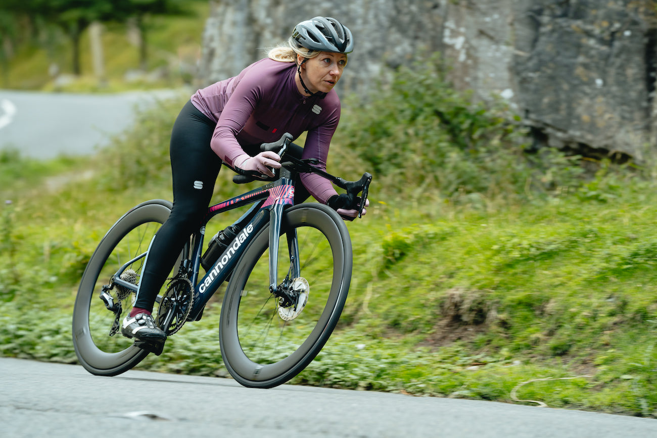 Female cyclist riding wearing WS Essential 2 Womens Gloves 2