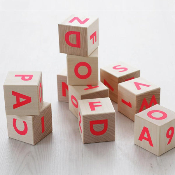 pink wooden alphabet blocks