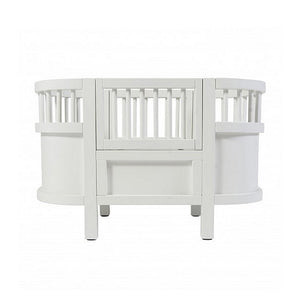 white wooden dolls bed