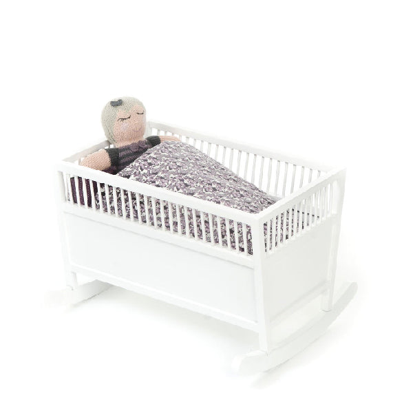 white wooden doll cradle