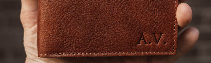 brown embossed leather wallet with initials