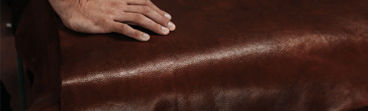 finishing a sheet of black leather