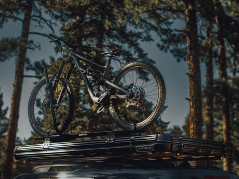 Bike mounted on top of hardshell tent