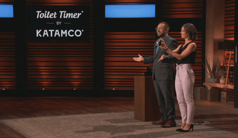 demonstrating toilet timer on shark tank