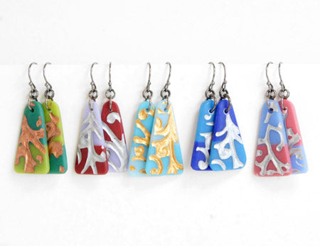 five pairs of glass triangle shaped drop earrings with textured vine design and metallic detail