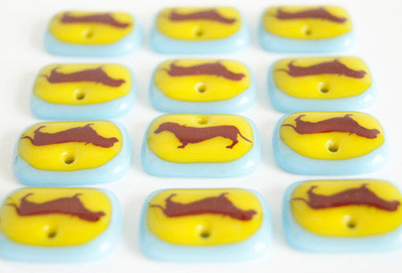 Dachshund pendant necklaces handmade in sunny yellow and ice blue glass