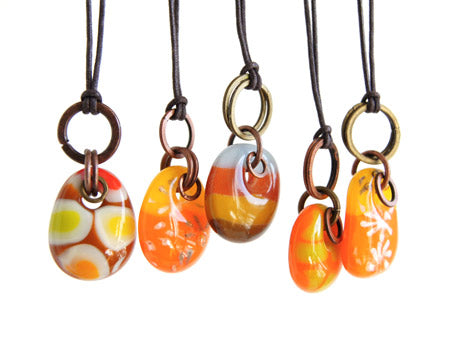 Fun orange, yellow and brown one of a kind glass drop necklaces with copper and brass on cord. 