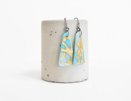 Triangle drop earrings in ice blue, aquamarine and gold, handmade in glass by Leila Cools