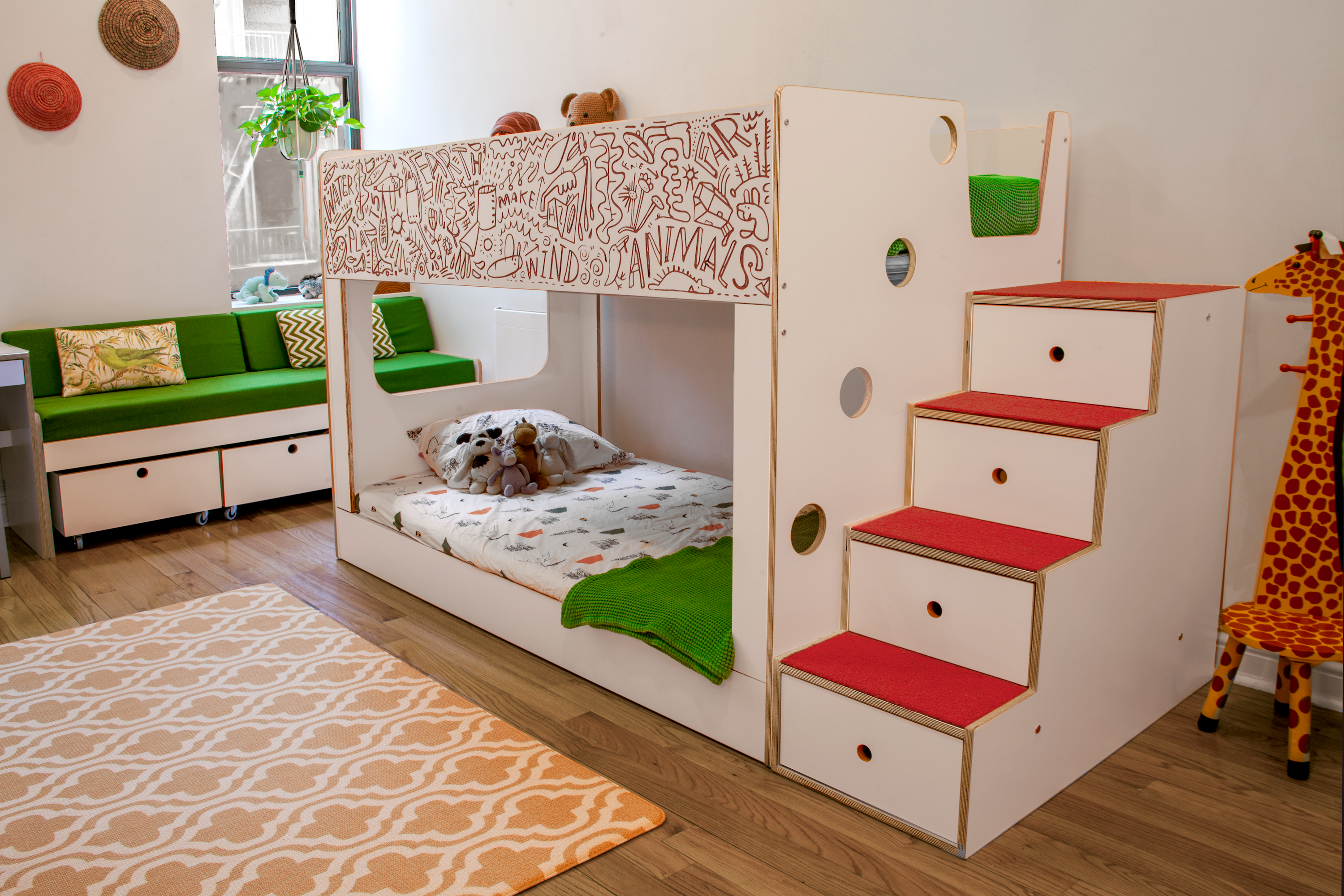 Colorful child's room with a white patterned bunk bed, green and red accents, and an orange rug.