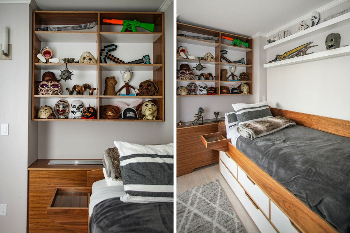 Bedroom with a shelf of various skulls, masks, and gray bedding.