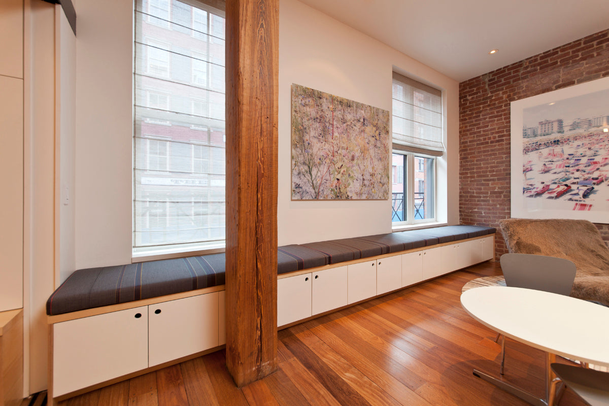 Modern living room, brick wall, wooden beam, art decor.