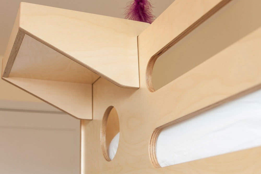 Close-up of a modern wooden shelf with unique design details.