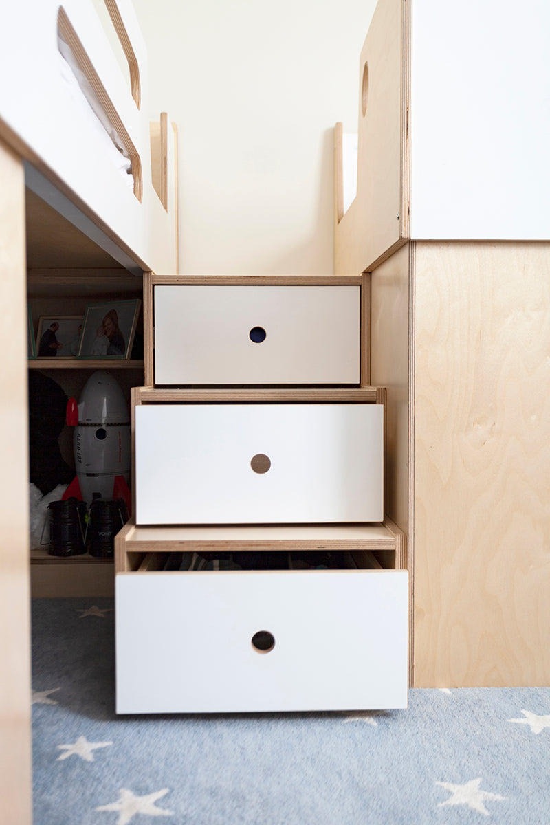 Open dresser drawers revealing toys and clothes.