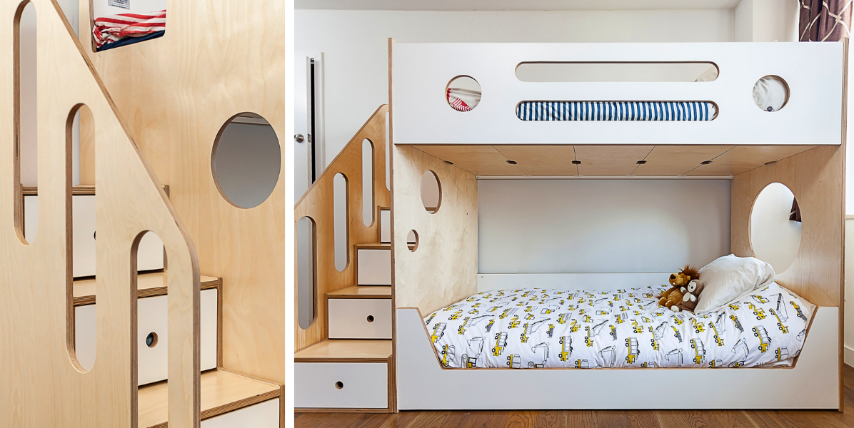 Modern bunk bed with wooden stairs, storage drawers, cut-out designs, and toy-themed bedding on the lower bed.