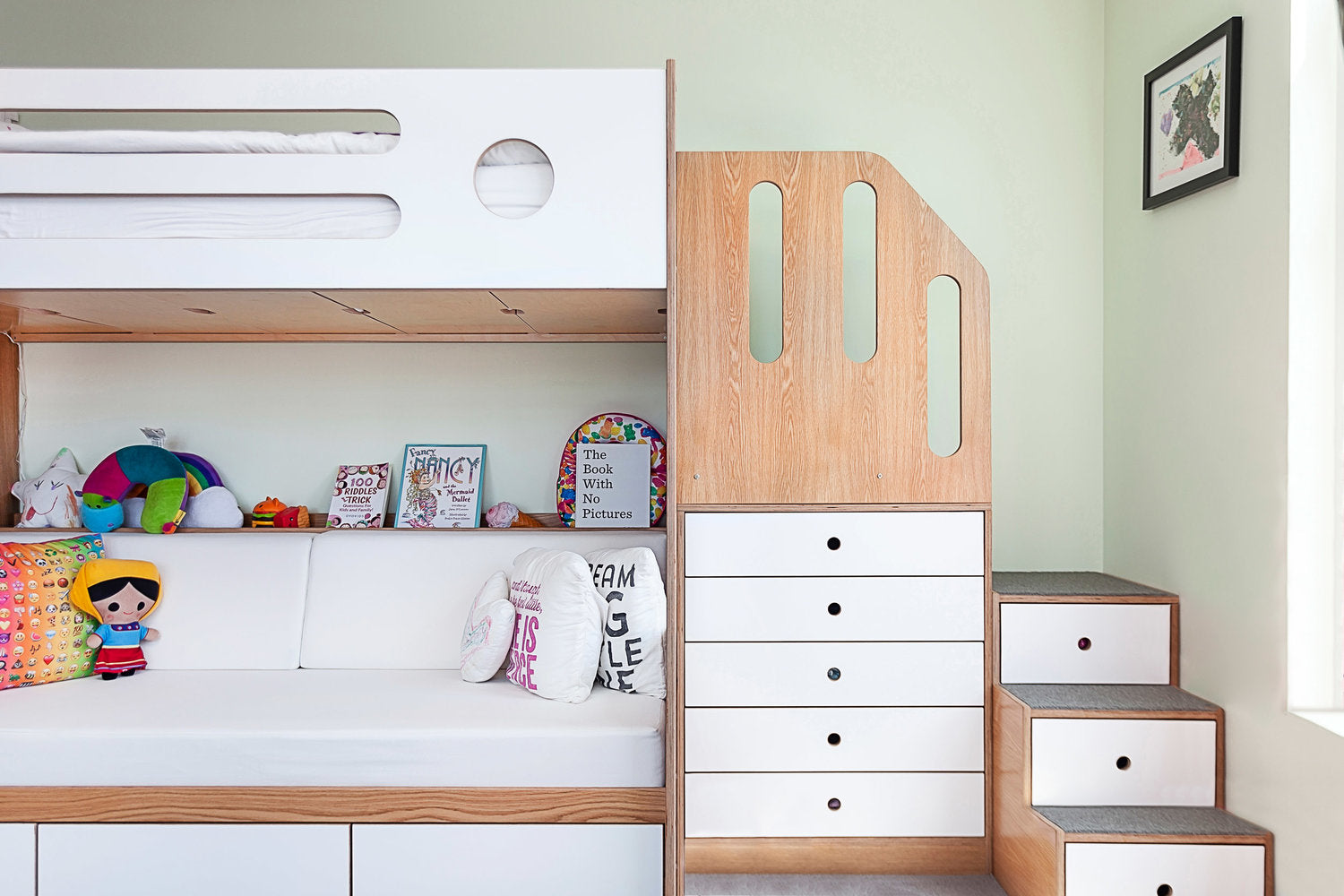  Modern kids’ room with bunk bed, storage, and colorful toys.