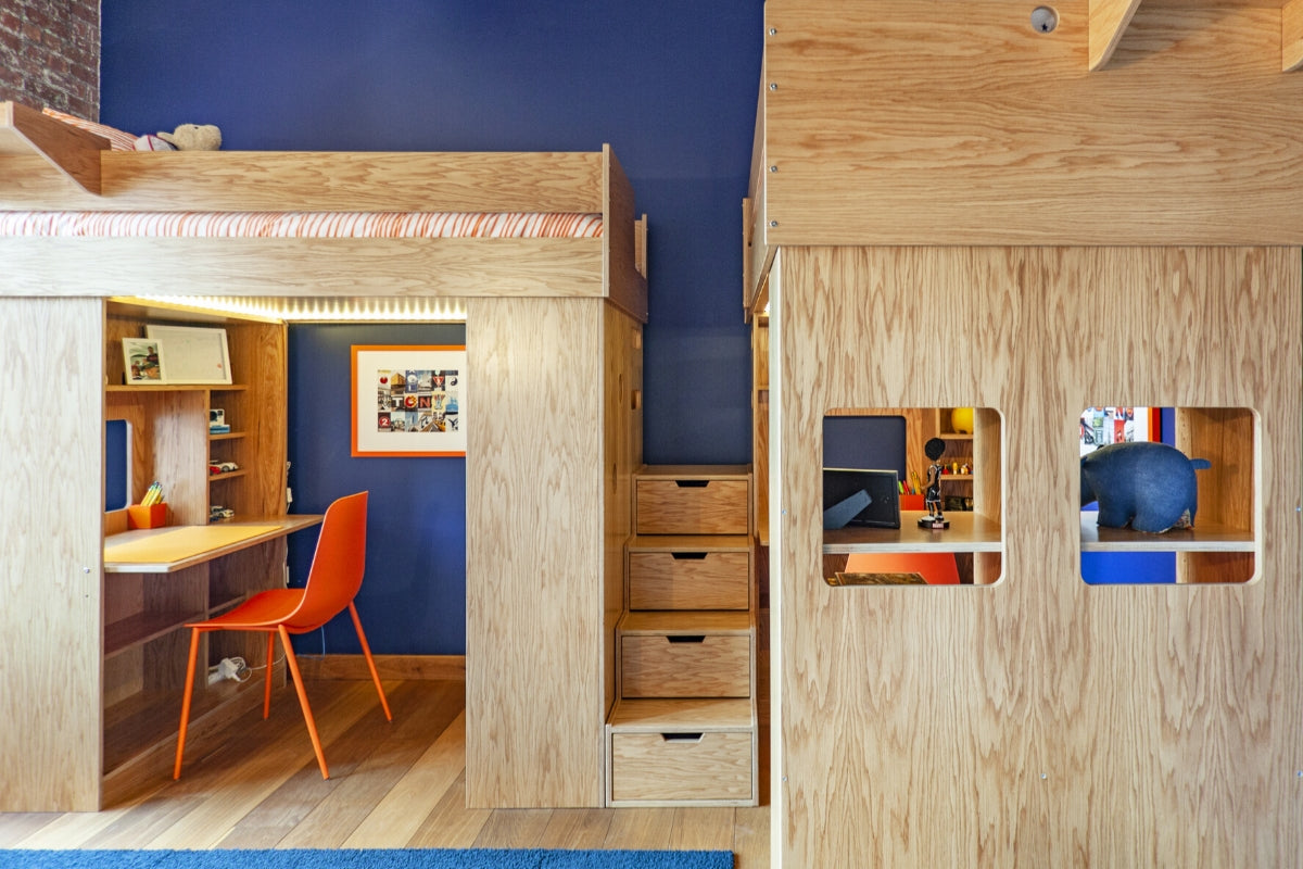 Compact wooden home office with built-in desk and cozy nooks.