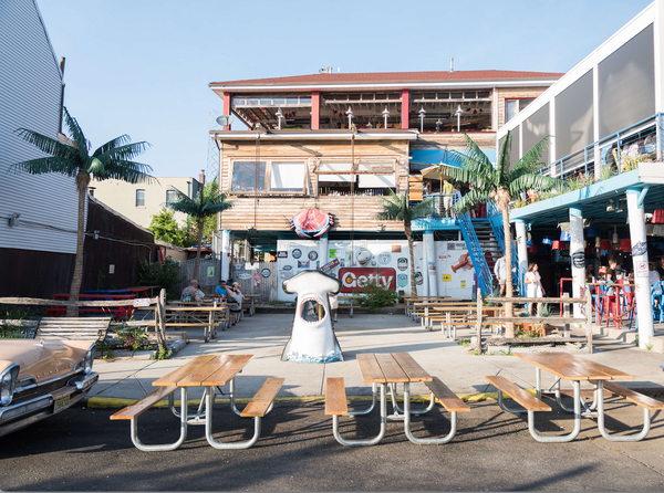 A group of benches and tables outside a building