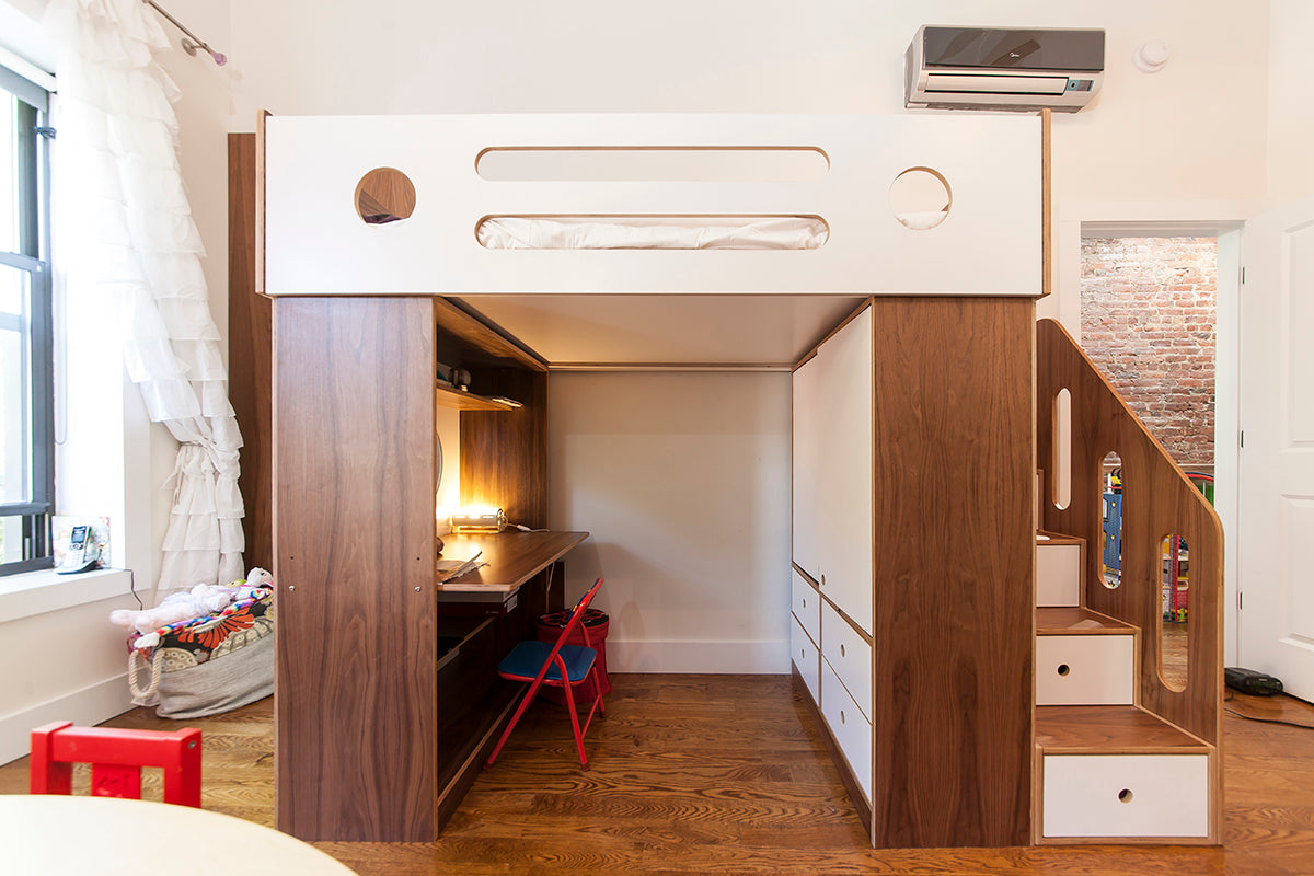 Modern loft bed with desk, stairs, and storage for small spaces.