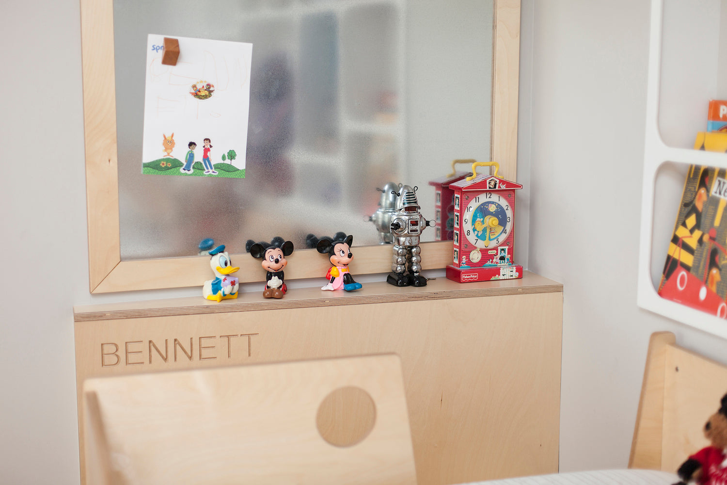 Child’s room shelf with toys, Mickey figures, name ‘BENNETT’