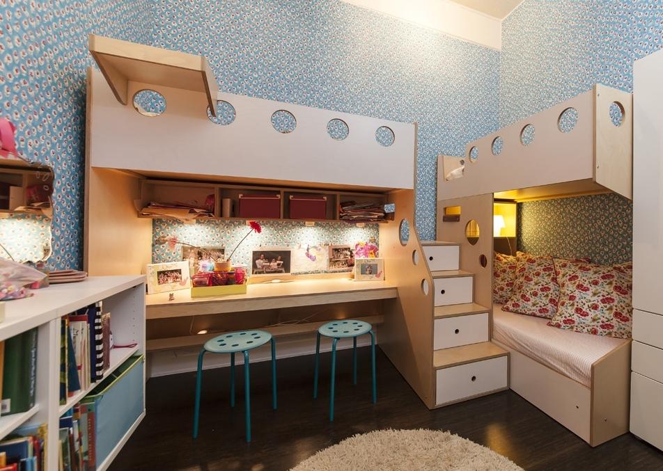 Cozy children's room with floral wallpaper, a study area, and an upper bunk bed with lights.