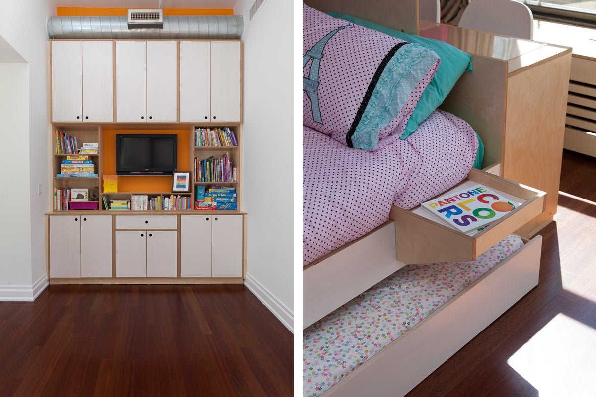 Bedroom with built-in wall unit, TV, books, and bed featuring storage drawer.