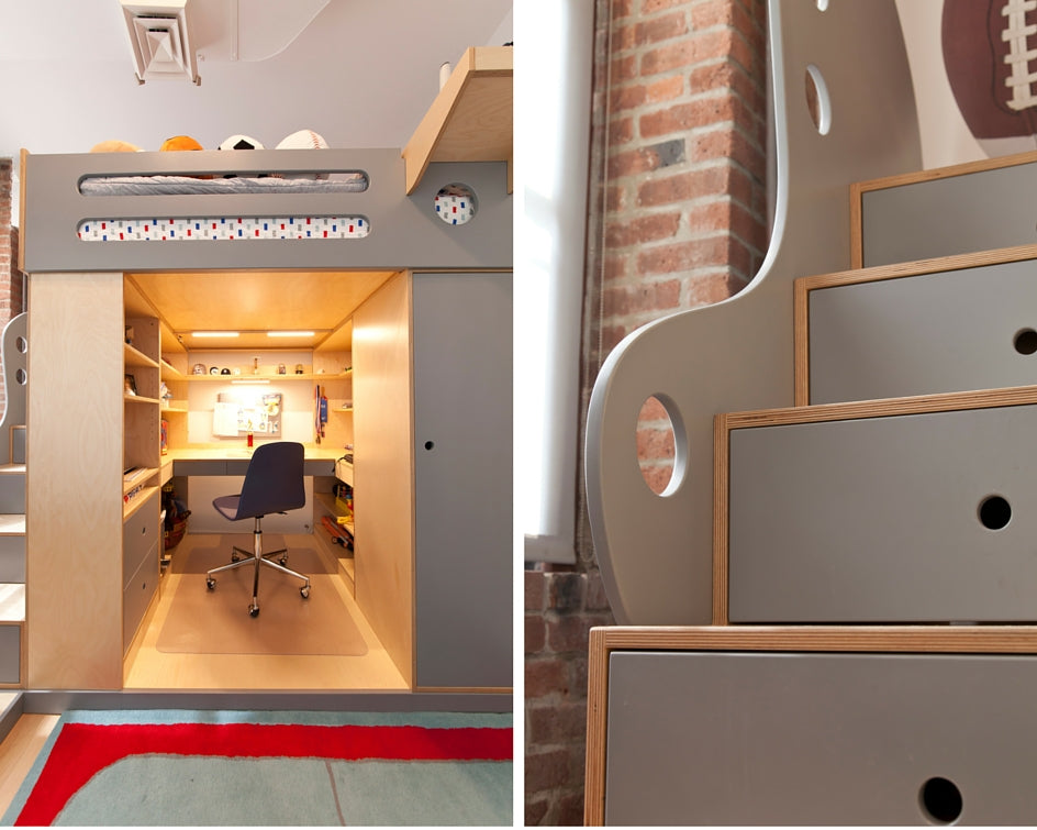 Cozy under-stair office with chair, desk, shelves, and ambient lighting.