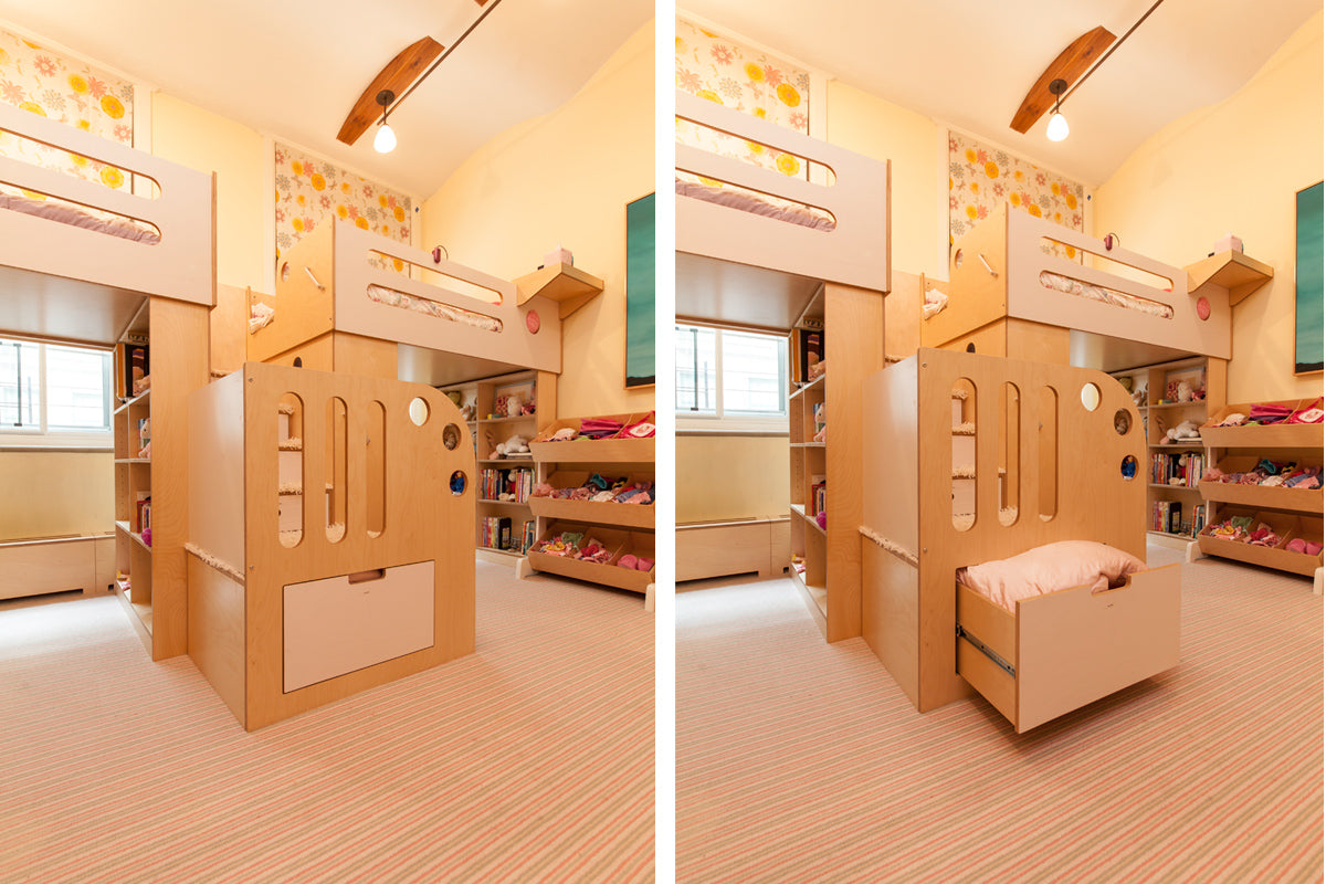 Bright children's room with wooden bunk beds, abundant storage, playful decorations, and natural light.