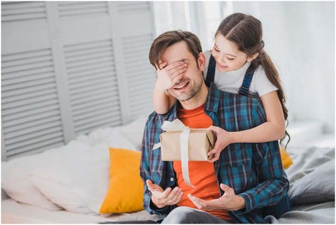 Daughter Giving Gift her Father