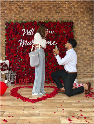 man-is-proposing-his-girlfriend-with-ring-and-rose-romantically-and-she-said-yes