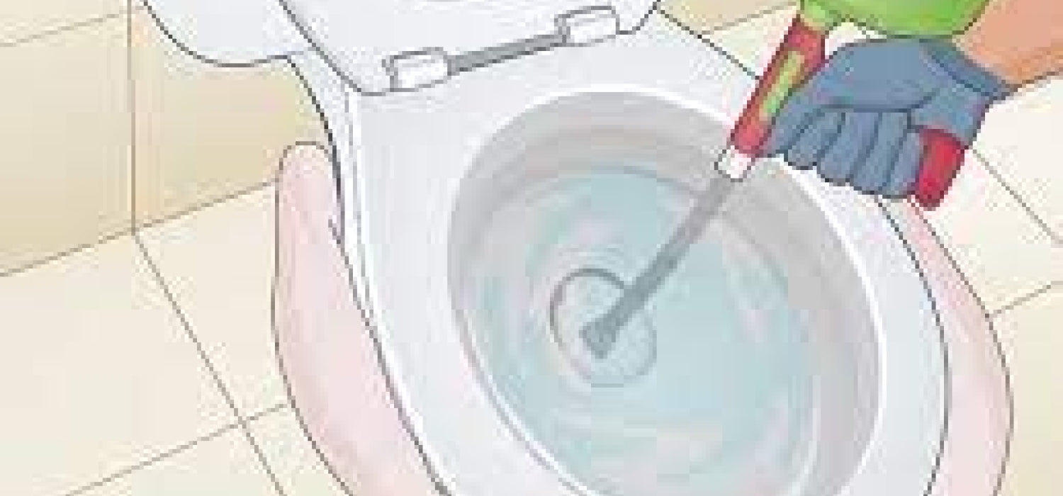 débloquer les toilettes à l'aide de la tarière des toilettes