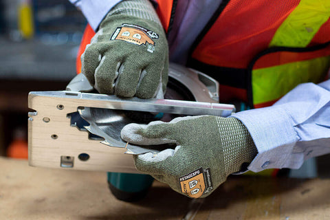 Grimes Industrial Products Group - Cut resistant gloves handling a blade.