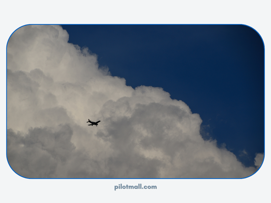 A Small Aircraft Flying above the clouds - Pilot Mall