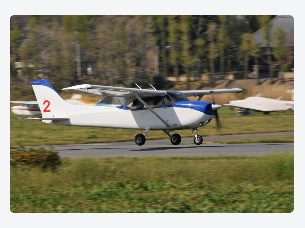 A White and Blue Cessna Coming in for a Landing - Pilot Mall